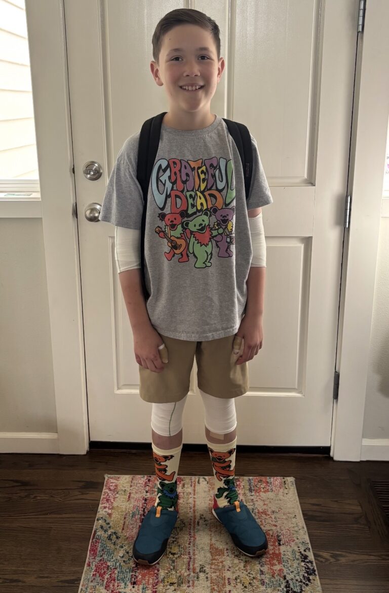 Patterson, smiling through his bandage, full of excitement and courage on his first day of school.
